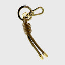 Abro Dalia Taschenanhänger aus olivfarbenem Leder mit Knotenoptik und goldfarbenem Karabiner