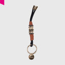 CROMIA CHARM SOPHIE Taschenanhänger aus Leder mit dekorativen goldfarbenen Metallringen, Lederwicklungen und CROMIA Logo-Anhänger