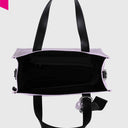 Kleine REBELLE Poppy Nylon Handtasche mit abnehmbarem Schulterriemen und REBELLE Logo